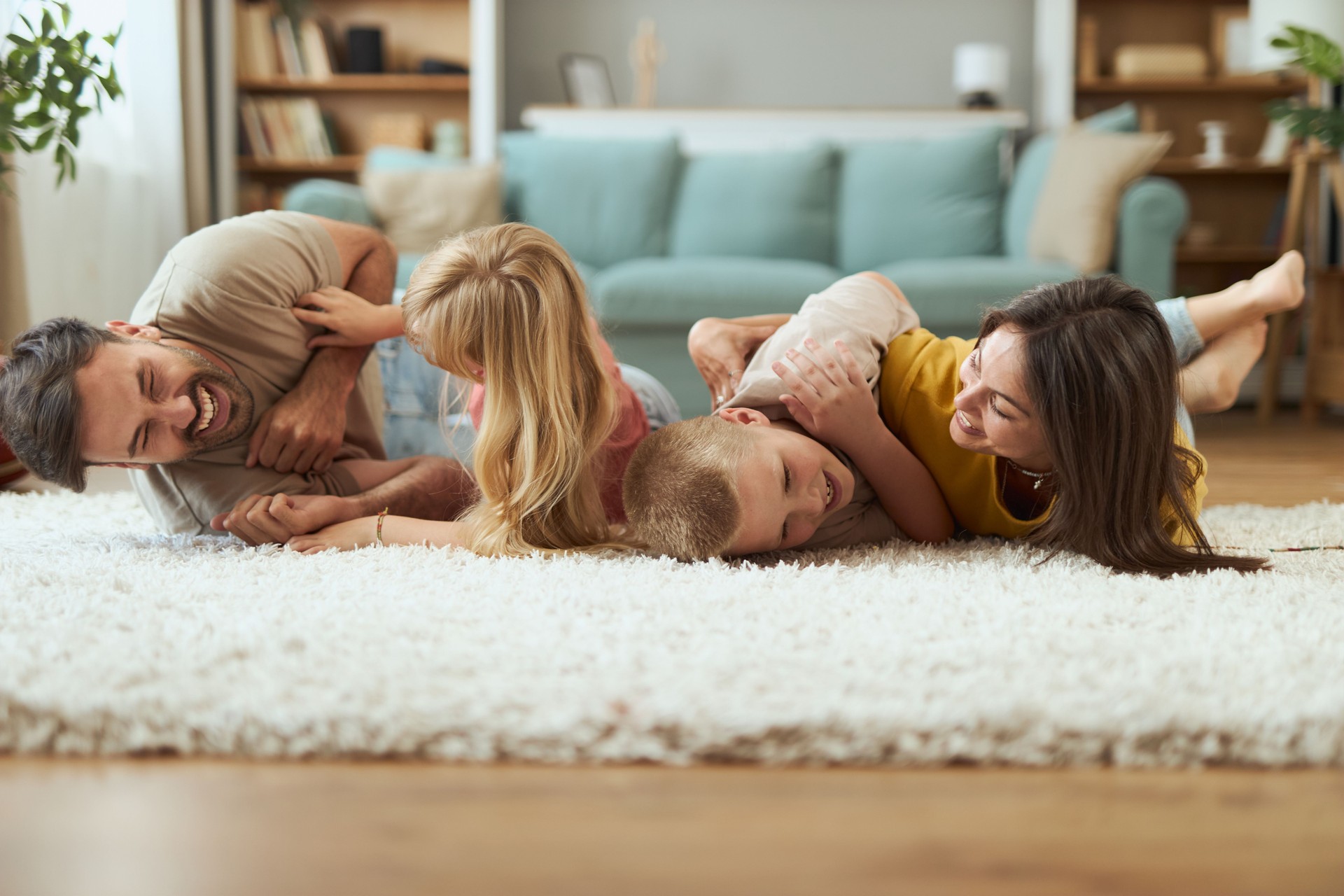 Cheerful family having fun while playing at home